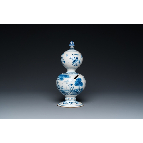 1291 - A Dutch Delft blue and white double gourd money bank with a deer hunt, dated 1732H.: 25 cm... 