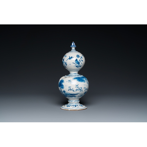 1291 - A Dutch Delft blue and white double gourd money bank with a deer hunt, dated 1732H.: 25 cm... 