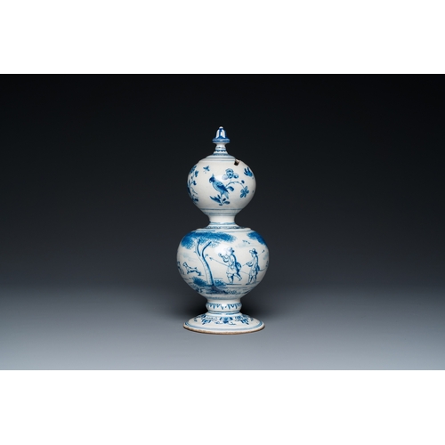 1291 - A Dutch Delft blue and white double gourd money bank with a deer hunt, dated 1732H.: 25 cm... 