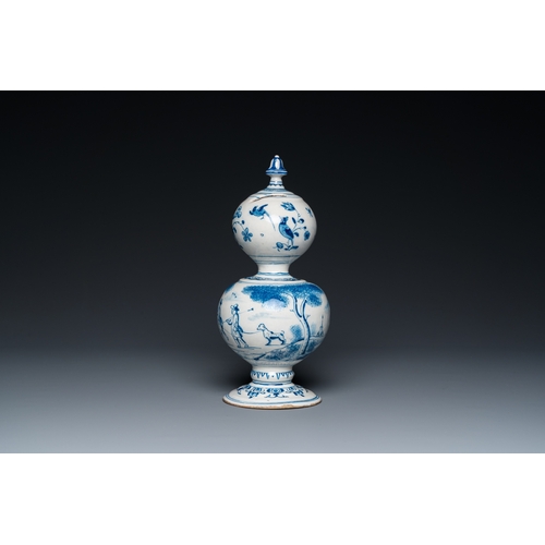 1291 - A Dutch Delft blue and white double gourd money bank with a deer hunt, dated 1732H.: 25 cm... 