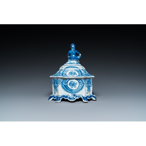 1298 - A Dutch Delft blue and white tobacco box with a nobleman holding a roll of tobacco, 2nd half 18th C.... 