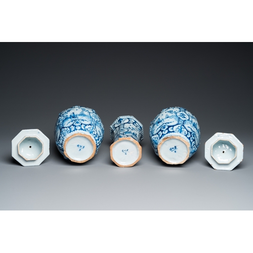 1308 - A Dutch Delft blue and white chinoiserie garniture of three vases, 18th C.H.: 34 cm (the tallest)... 