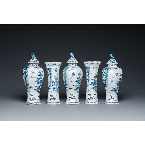 1312 - A Dutch Delft blue and white five-piece chinoiserie garniture, 1st quarter 18th C.H.: 32,5 cm (the t... 