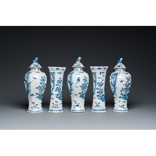 1312 - A Dutch Delft blue and white five-piece chinoiserie garniture, 1st quarter 18th C.H.: 32,5 cm (the t... 