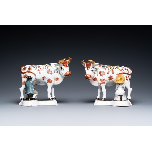 1319 - A pair of cold-painted white Dutch Delftware milking groups, 18th C.L.: 22 cm - H.: 18,5 cm... 