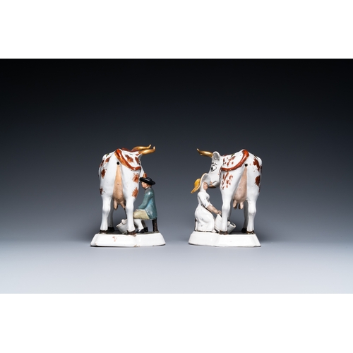 1319 - A pair of cold-painted white Dutch Delftware milking groups, 18th C.L.: 22 cm - H.: 18,5 cm... 