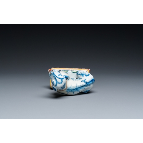 1322 - A polychrome Dutch Delft dog seated on a plinth, 18th C.H.: 12 cm
 
 Provenance:- A private collecti... 