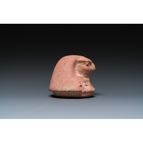 1397 - An Egyptian light brown limestone canopic lid in the shape of a falcon head, Late PeriodH.: 11 cm (i... 