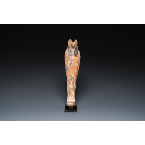 1398 - An Egyptian stucco painted wooden mummiform figure of Anubis, New KingdomH.: 46 cm (incl. the stand)... 