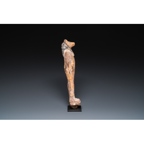 1398 - An Egyptian stucco painted wooden mummiform figure of Anubis, New KingdomH.: 46 cm (incl. the stand)... 