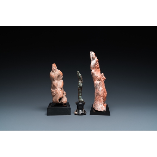 1399 - Two Egyptian terracotta sculptures, a bronze sculpture of Osiris and a turquoise frit amulet, Late p... 