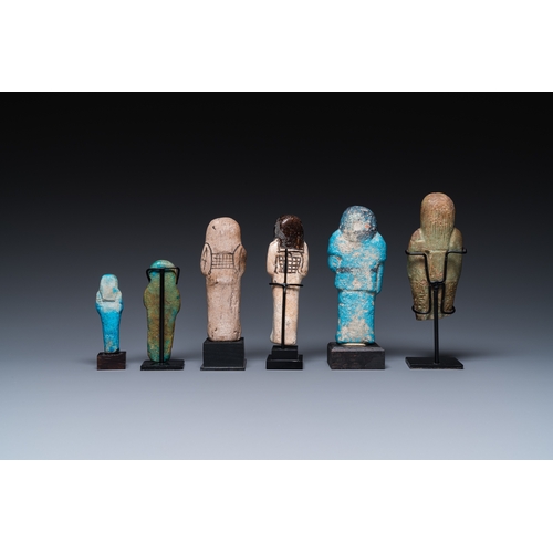 1401 - Six Egyptian green- and turquoise-glazed frit ushabtis, Late PeriodH.: 17 cm (the tallest incl. stan... 