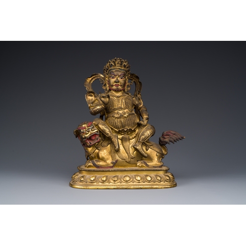 261 - A Sino-Tibetan gilt bronze sculpture of Vaishravana on a Buddhist lion, probably 17th C.Description:... 