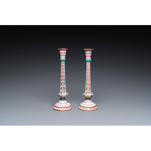 37 - A pair of Chinese Canton enamel 'lotus' candlesticks, YongzhengDescription:H.: 25 cmCondition:The ab... 