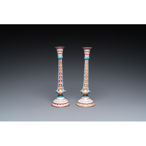 37 - A pair of Chinese Canton enamel 'lotus' candlesticks, YongzhengDescription:H.: 25 cmCondition:The ab... 