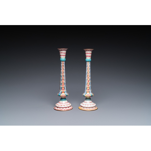 37 - A pair of Chinese Canton enamel 'lotus' candlesticks, YongzhengDescription:H.: 25 cmCondition:The ab... 