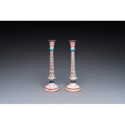 37 - A pair of Chinese Canton enamel 'lotus' candlesticks, YongzhengDescription:H.: 25 cmCondition:The ab... 