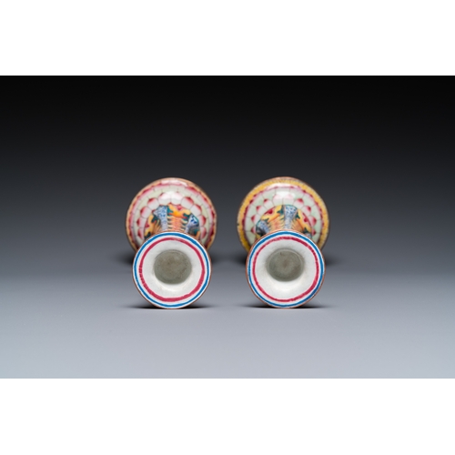 37 - A pair of Chinese Canton enamel 'lotus' candlesticks, YongzhengDescription:H.: 25 cmCondition:The ab... 