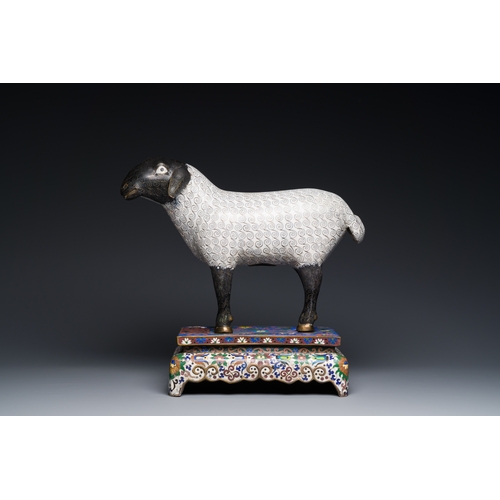 44 - A Chinese cloisonne model of a sheep standing on a rectangular base with Arabic inscription, QingDes... 