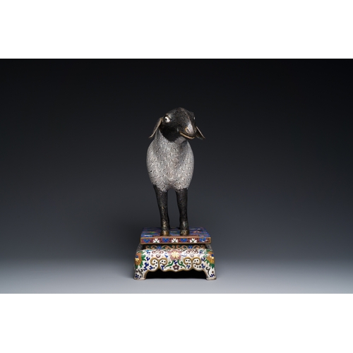 44 - A Chinese cloisonne model of a sheep standing on a rectangular base with Arabic inscription, QingDes... 