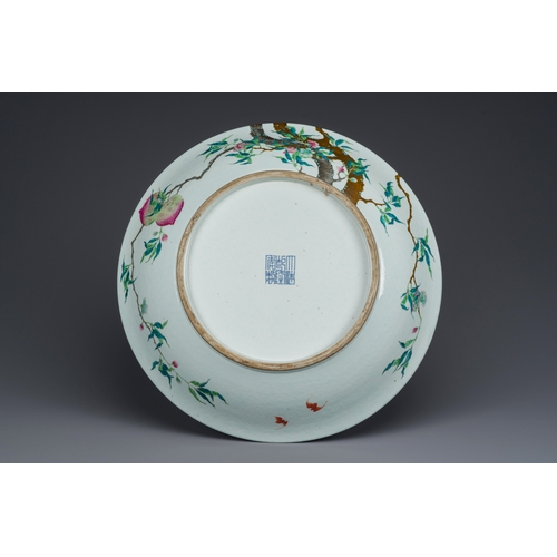 46 - A fine and large Chinese famille rose 'nine peaches' dish, Qianlong mark, 19th C.Description:Dia.: 5... 