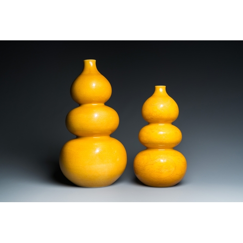 5 - Two Chinese monochrome yellow-glazed triple gourd vases with incised designs of lotus scrolls and dr... 