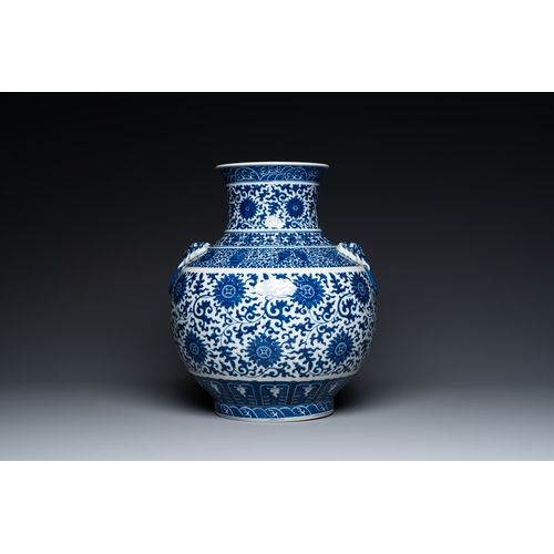 53 - A Chinese blue and white 'hu' vase with lotus scrolls, Qianlong mark, 19th C.Description:H.: 33,5 cm... 