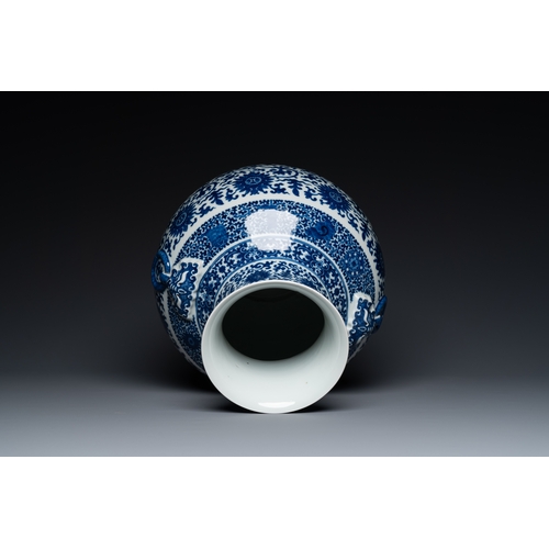 53 - A Chinese blue and white 'hu' vase with lotus scrolls, Qianlong mark, 19th C.Description:H.: 33,5 cm... 