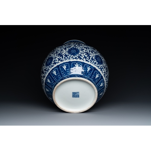 53 - A Chinese blue and white 'hu' vase with lotus scrolls, Qianlong mark, 19th C.Description:H.: 33,5 cm... 