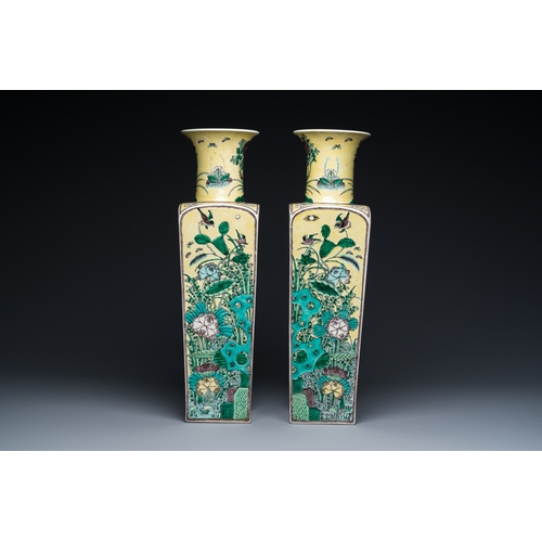 6 - A pair of Chinese square yellow-ground famille verte vases, Kangxi mark, 19th C.Description:H.: 51 c... 