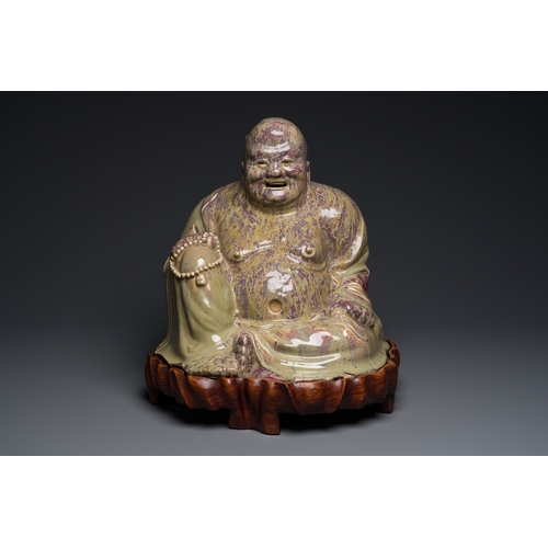 65 - A massive Chinese flambe-glazed Shiwan pottery figure of Buddha, 18/19th C.Description:H.: 47,5 cm (... 