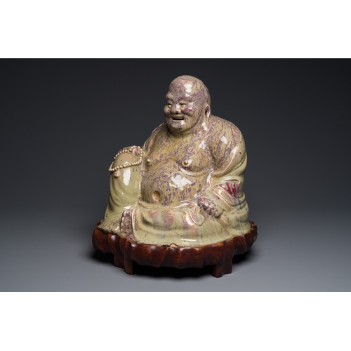 65 - A massive Chinese flambe-glazed Shiwan pottery figure of Buddha, 18/19th C.Description:H.: 47,5 cm (... 