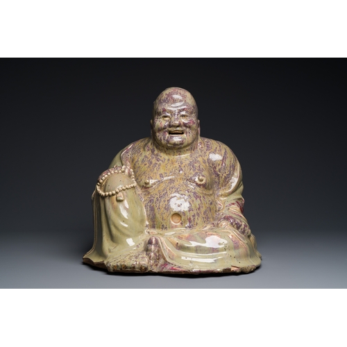 65 - A massive Chinese flambe-glazed Shiwan pottery figure of Buddha, 18/19th C.Description:H.: 47,5 cm (... 