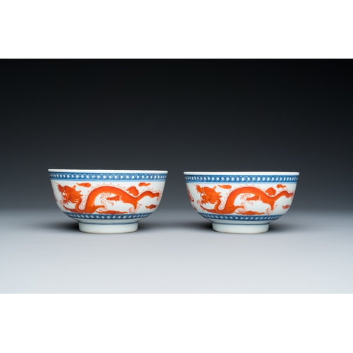 73 - A pair of Chinese blue, white and iron-red 'dragon' bowls, Xuantong mark and of the periodDescriptio... 