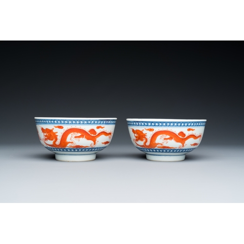 73 - A pair of Chinese blue, white and iron-red 'dragon' bowls, Xuantong mark and of the periodDescriptio... 