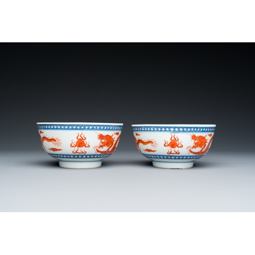 73 - A pair of Chinese blue, white and iron-red 'dragon' bowls, Xuantong mark and of the periodDescriptio... 