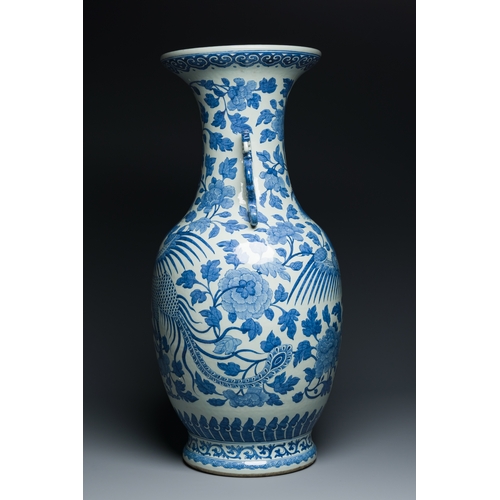 81 - A large Chinese blue and white dragon-handled 'phoenix and peony' vase, 19th C.Description:H.: 82 cm... 