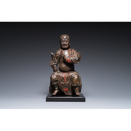 117 - A Chinese lacquered and polychromed wood sculpture of a Buddhist guardian, MingDescription:H.: 42,5 ... 