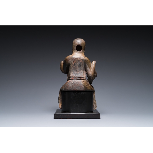 117 - A Chinese lacquered and polychromed wood sculpture of a Buddhist guardian, MingDescription:H.: 42,5 ... 