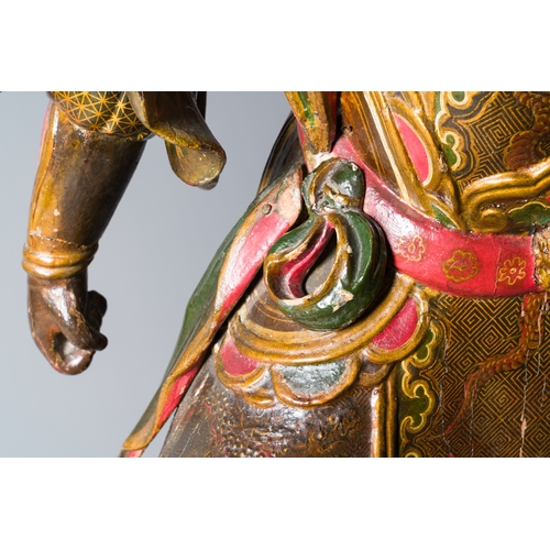 119 - A large Japanese polychromed and gilt-lacquered wood figure of a divine general, Edo, dated 1623Desc... 