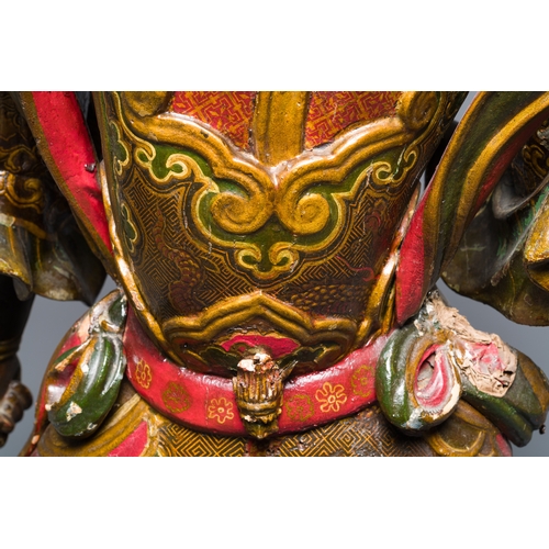 119 - A large Japanese polychromed and gilt-lacquered wood figure of a divine general, Edo, dated 1623Desc... 