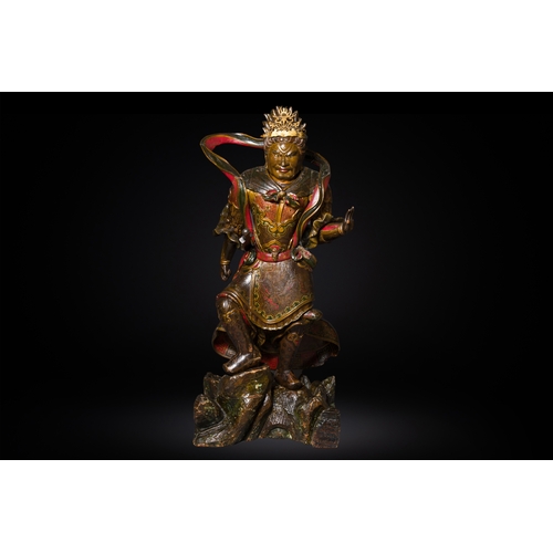 119 - A large Japanese polychromed and gilt-lacquered wood figure of a divine general, Edo, dated 1623Desc... 