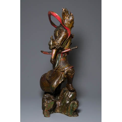 119 - A large Japanese polychromed and gilt-lacquered wood figure of a divine general, Edo, dated 1623Desc... 