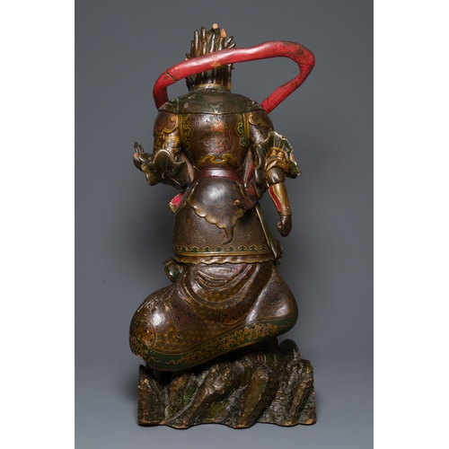 119 - A large Japanese polychromed and gilt-lacquered wood figure of a divine general, Edo, dated 1623Desc... 