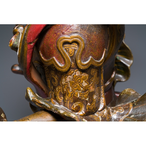 119 - A large Japanese polychromed and gilt-lacquered wood figure of a divine general, Edo, dated 1623Desc... 