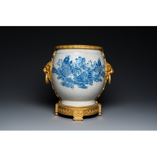 122 - A large Chinese blue and white crackle-glazed 'carps' vase with fine gilt bronze mounts, 18/19th C.D... 