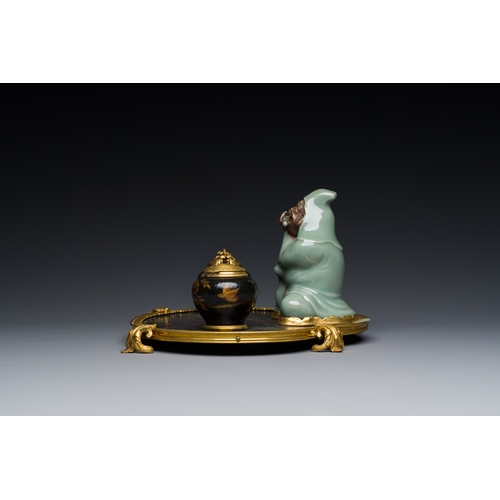 124 - A French lacquered and painted wood, gilt bronze and Japanese celadon porcelain inkwell desk set, la... 