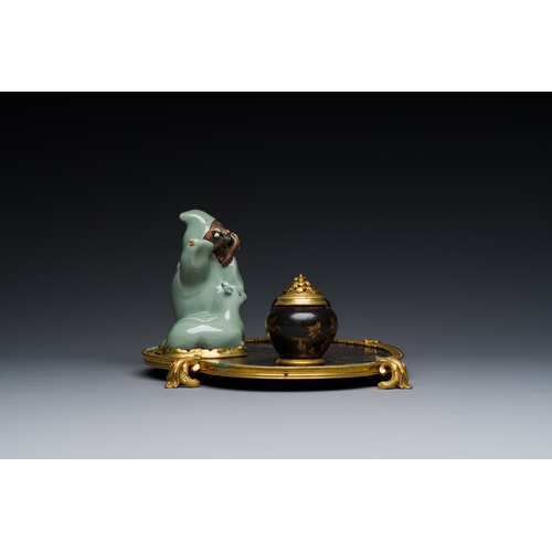 124 - A French lacquered and painted wood, gilt bronze and Japanese celadon porcelain inkwell desk set, la... 