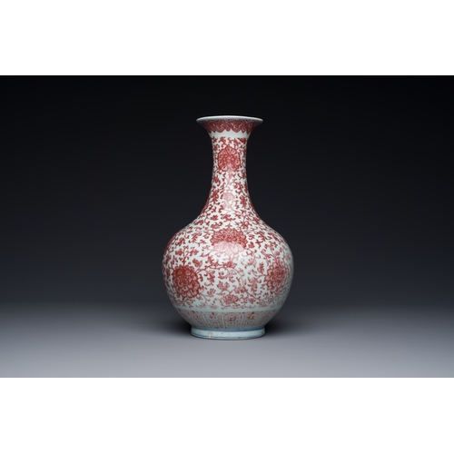 132 - A Chinese copper-red bottle vase with floral scrolls, QianlongDescription:H.: 30,5 cm Provenance: Th... 