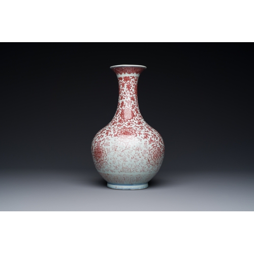 132 - A Chinese copper-red bottle vase with floral scrolls, QianlongDescription:H.: 30,5 cm Provenance: Th... 